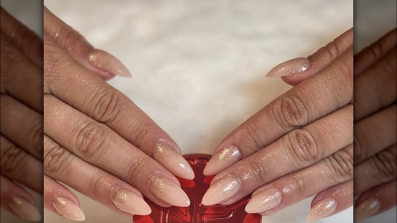Woman with nude almond nails