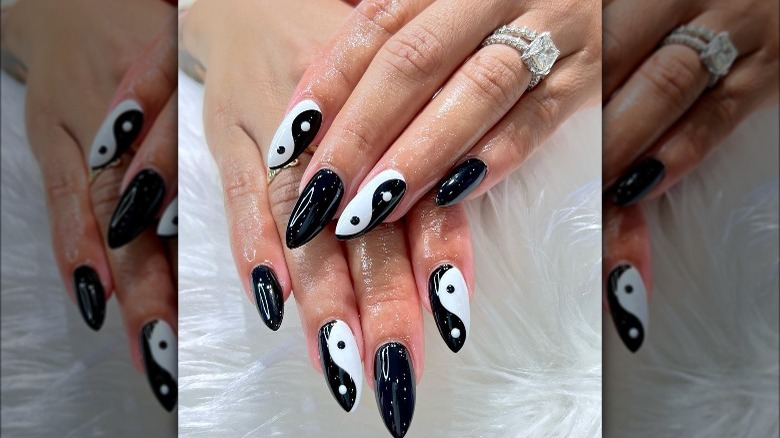 Woman with black and white nails