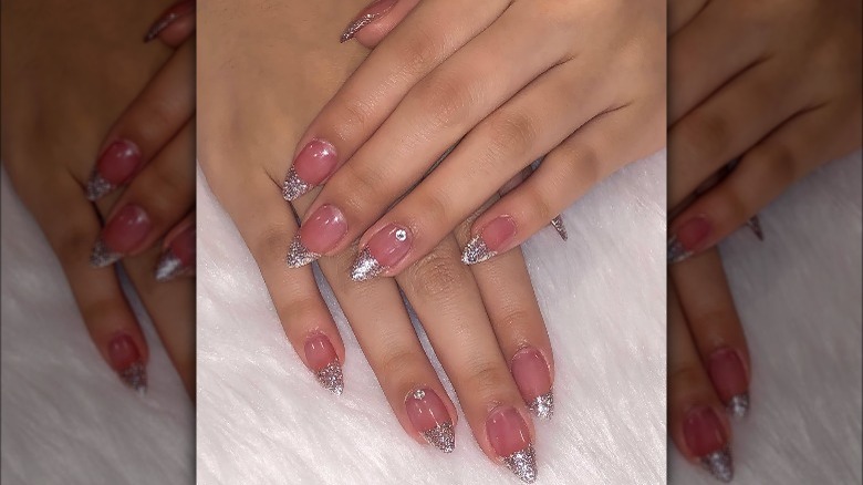 Woman with glitter tip nails