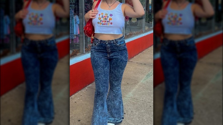 Woman in crop top flared jeans