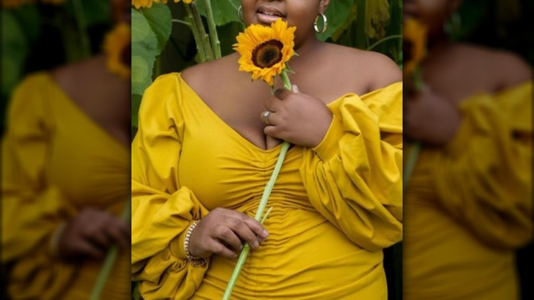 Woman yellow dress with sunflower