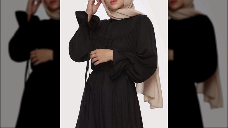 Hijabi woman in black dress 