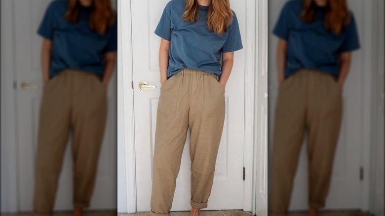 Woman blue t-shirt brown trousers 