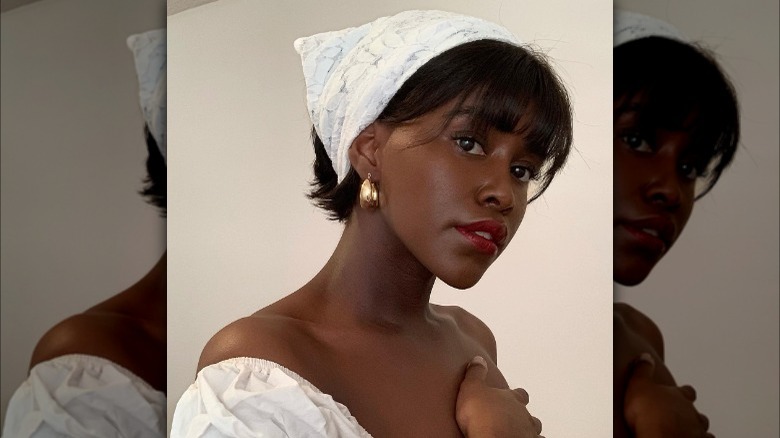 Woman wearing bandana, blunt bangs