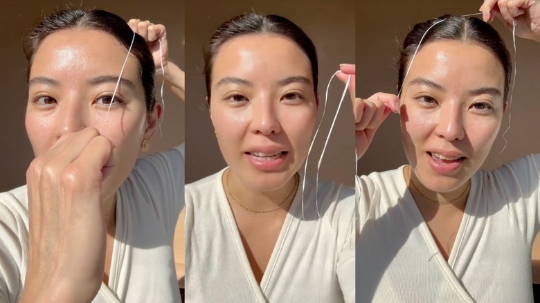 Woman using dental floss for hair frizz