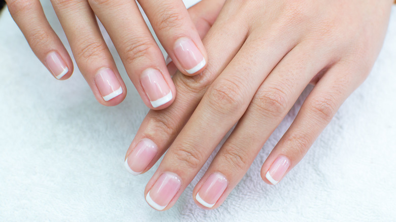 Woman with a French manicure