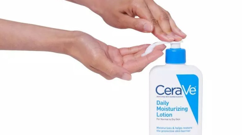 Person pumping CeraVe lotion