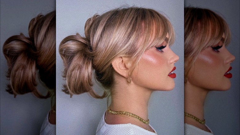 Loose updo with curtain bangs