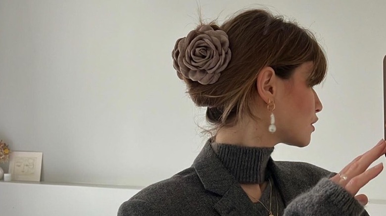 Chignon with flower hair piece