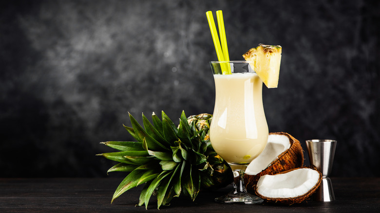 Two Piña Colada cocktails with pineapple and coconut