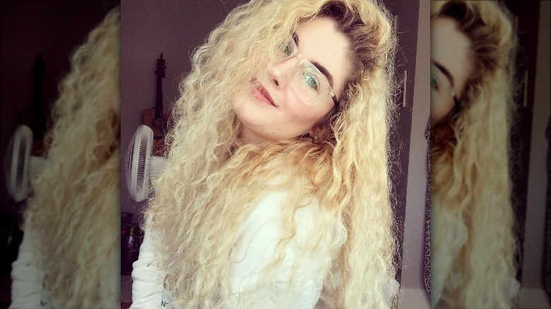 woman with curly blonde hair