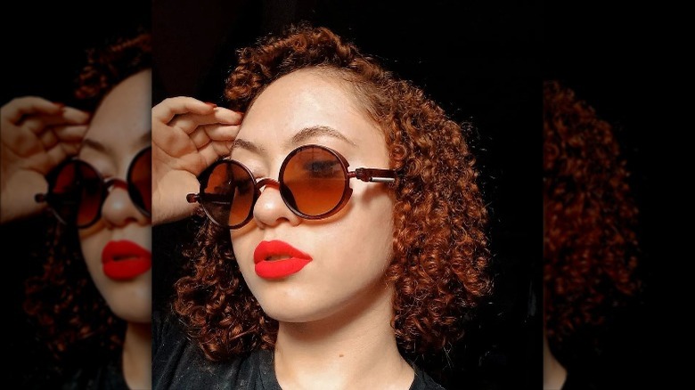 woman with short, tight ringlet curls