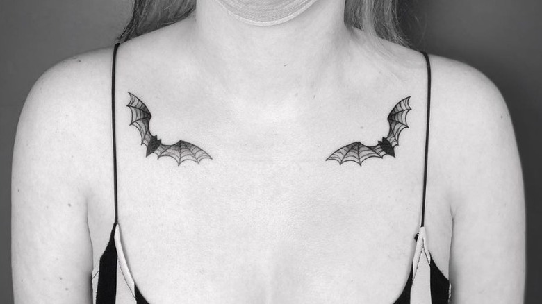 bat collar bone tattoo