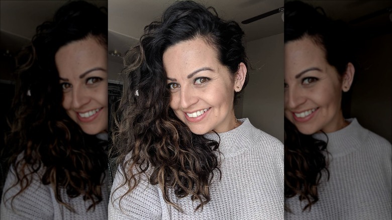 woman smiling with curly hair