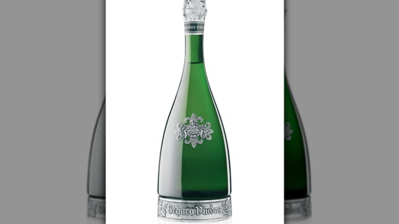 Silver and green wine bottle