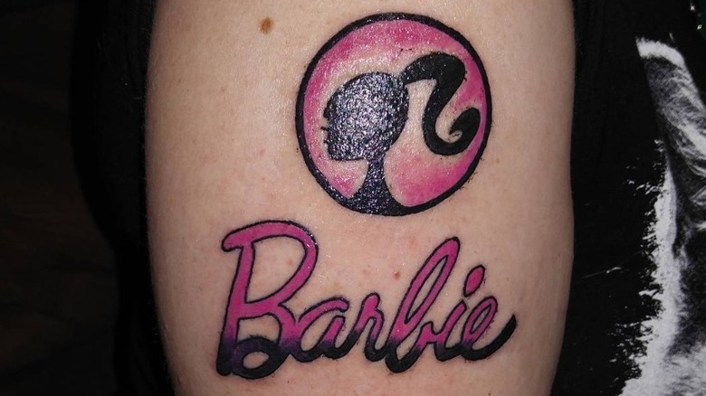 barbie silhouette and name tattoo on arm
