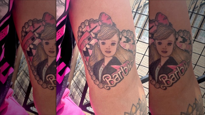 tattoo of executive barbie on arm