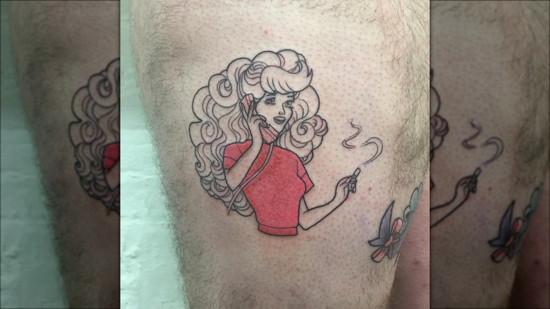 80s barbie tattoo on leg