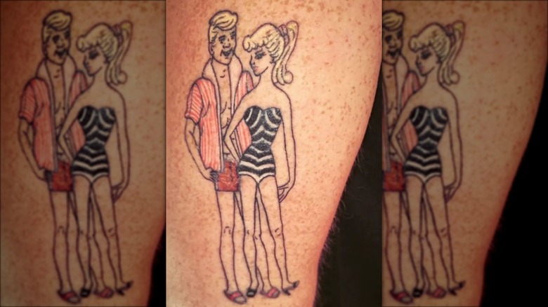 leg with vintage barbie and ken tattoos