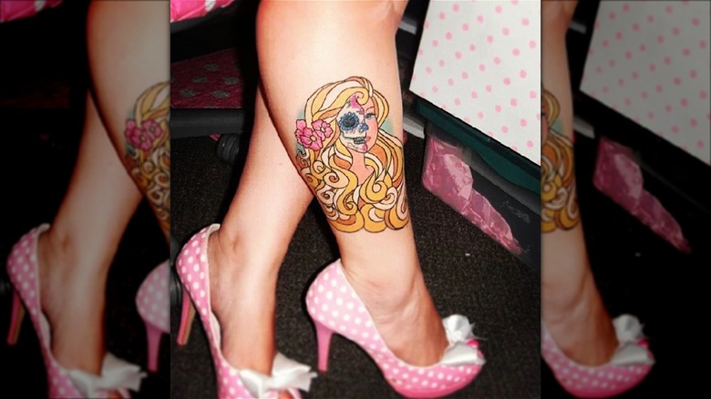 barbie skull tattoo on calf