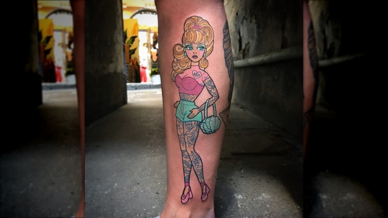 tattooed barbie tattoo on calf