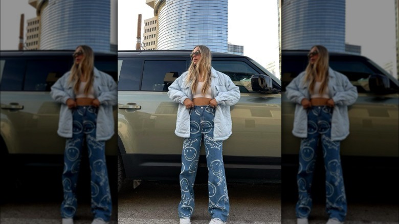 A woman wearing baggy jeans with a fun pattern