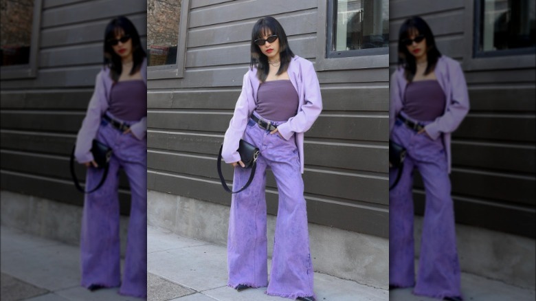 A woman in a purple monochromatic outfit