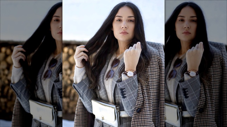 woman wearing layered plaid and houndstooth