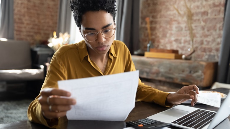 woman at computer looking at financials