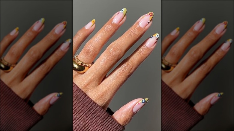 Yellow-tipped nails with flowers