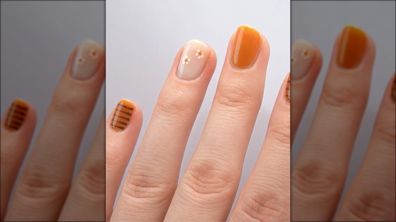 Orange nails with minimalist deisgn