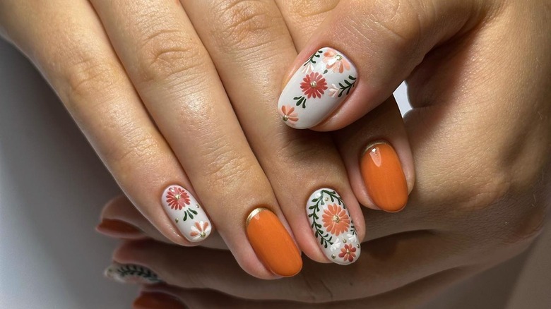 Orange, white and green nail art