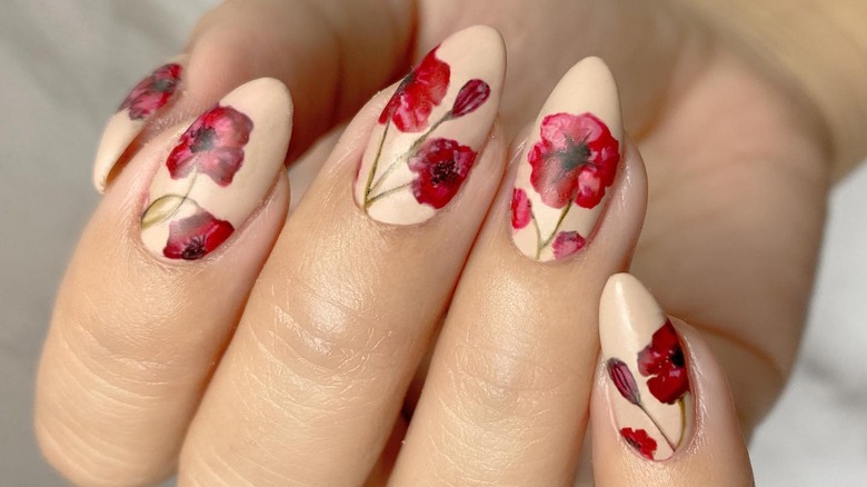 White manicure with red flowers