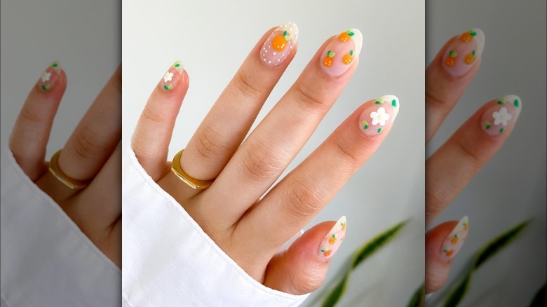 Oranges and daisies manicure