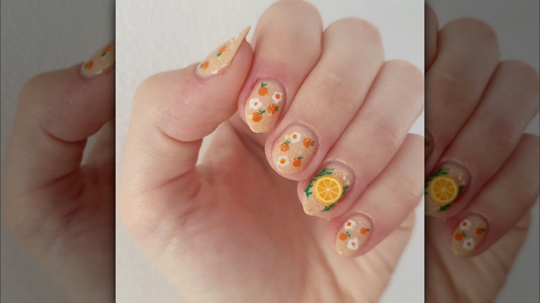 Orange and flower nails