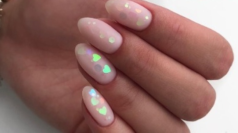 Nude nails with neon hearts