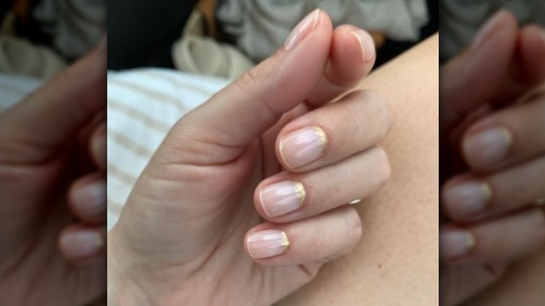 Neutral manicure with a gold frame