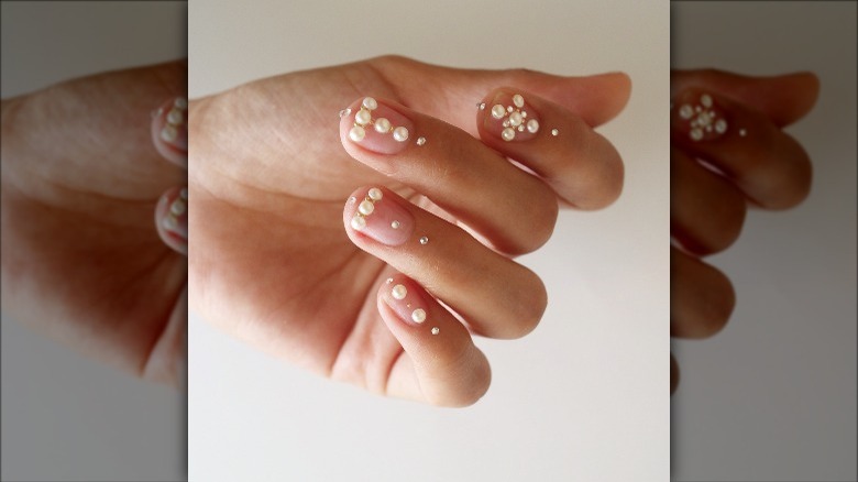 Pearl embellished manicured hands