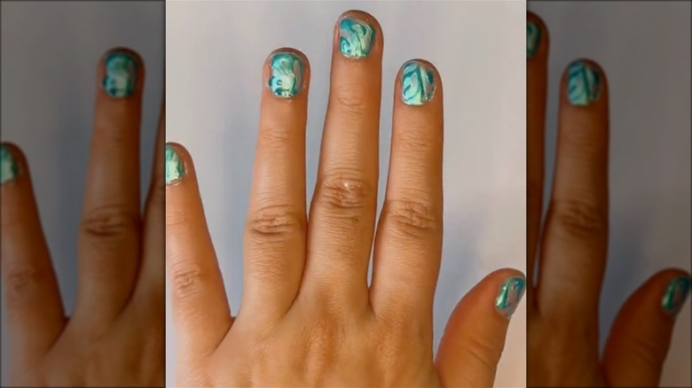 Teal + chrome swirl nails