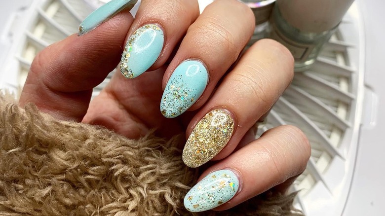 teal and gold nails