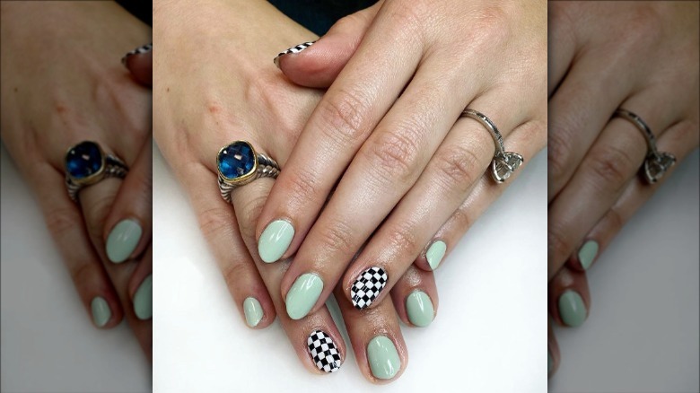 woman with small checkerboard nails