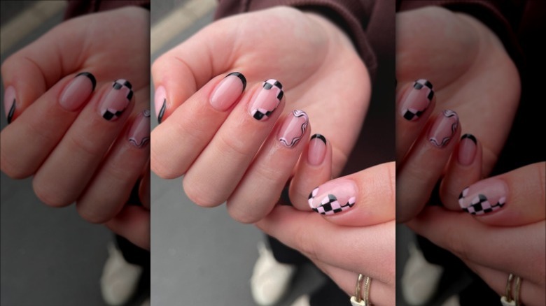 woman with wavy checkered nails