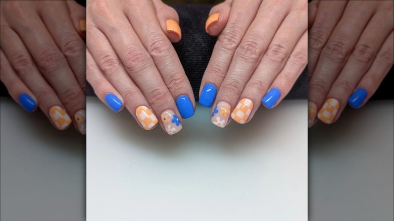 woman with checkered spring nails