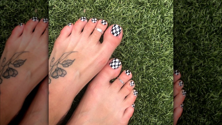 woman with checkered toenails