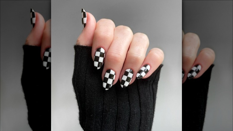 woman with black and white checkered nails