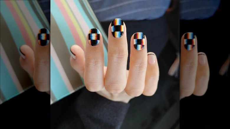 woman with glitchy checkered nails