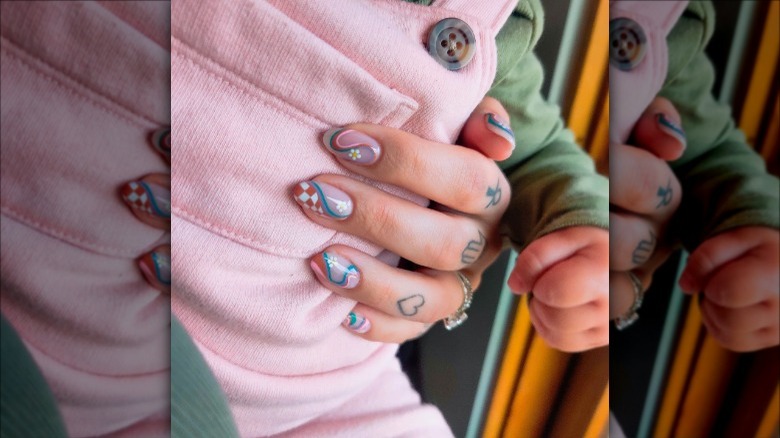 woman with 70s checkerboard nails