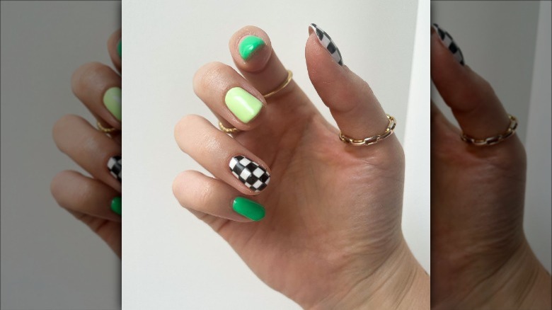 woman with green and checkered nails