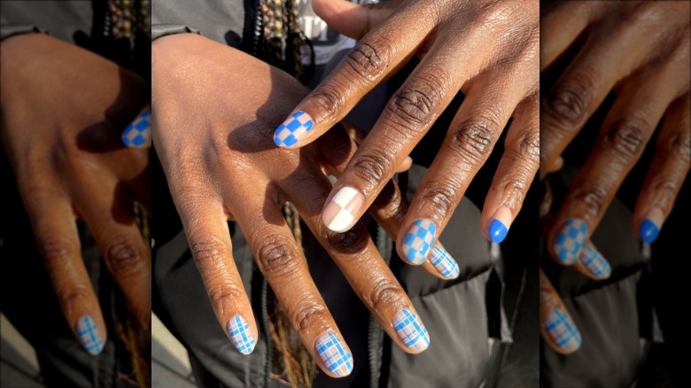 woman with blue checkered tartan nails