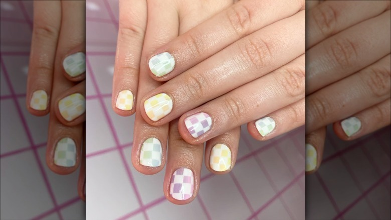 woman with pastel ombre checkered nails